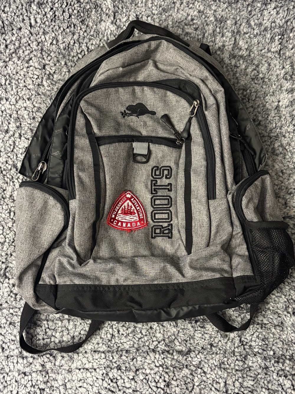 Roots Gray and Black Men's Backpack with Red Patch